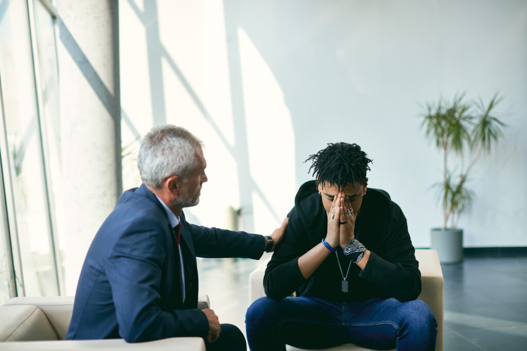 man talking to therapist about mental health crisis plan