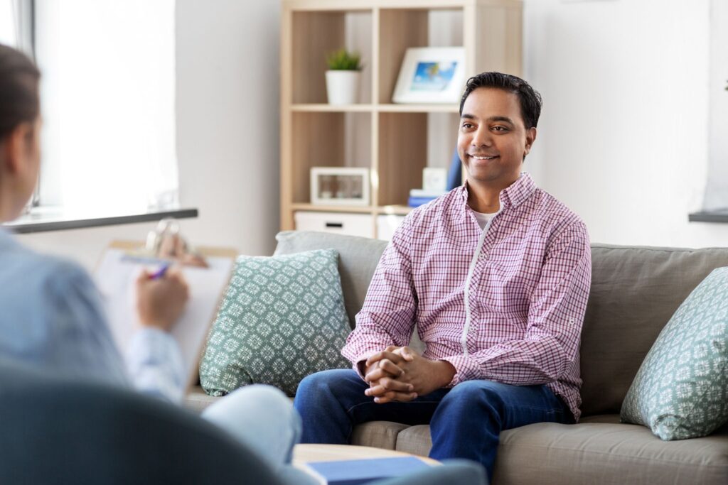 a man smiling during therapy