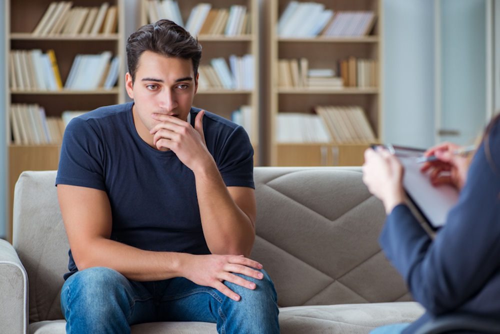 a man with mental health issues talking to a therapist