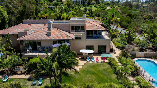 unnamed Luxury residential mental health treatment facility in Rancho Santa Fe, California with private accommodations, landscaped grounds, and a pool.