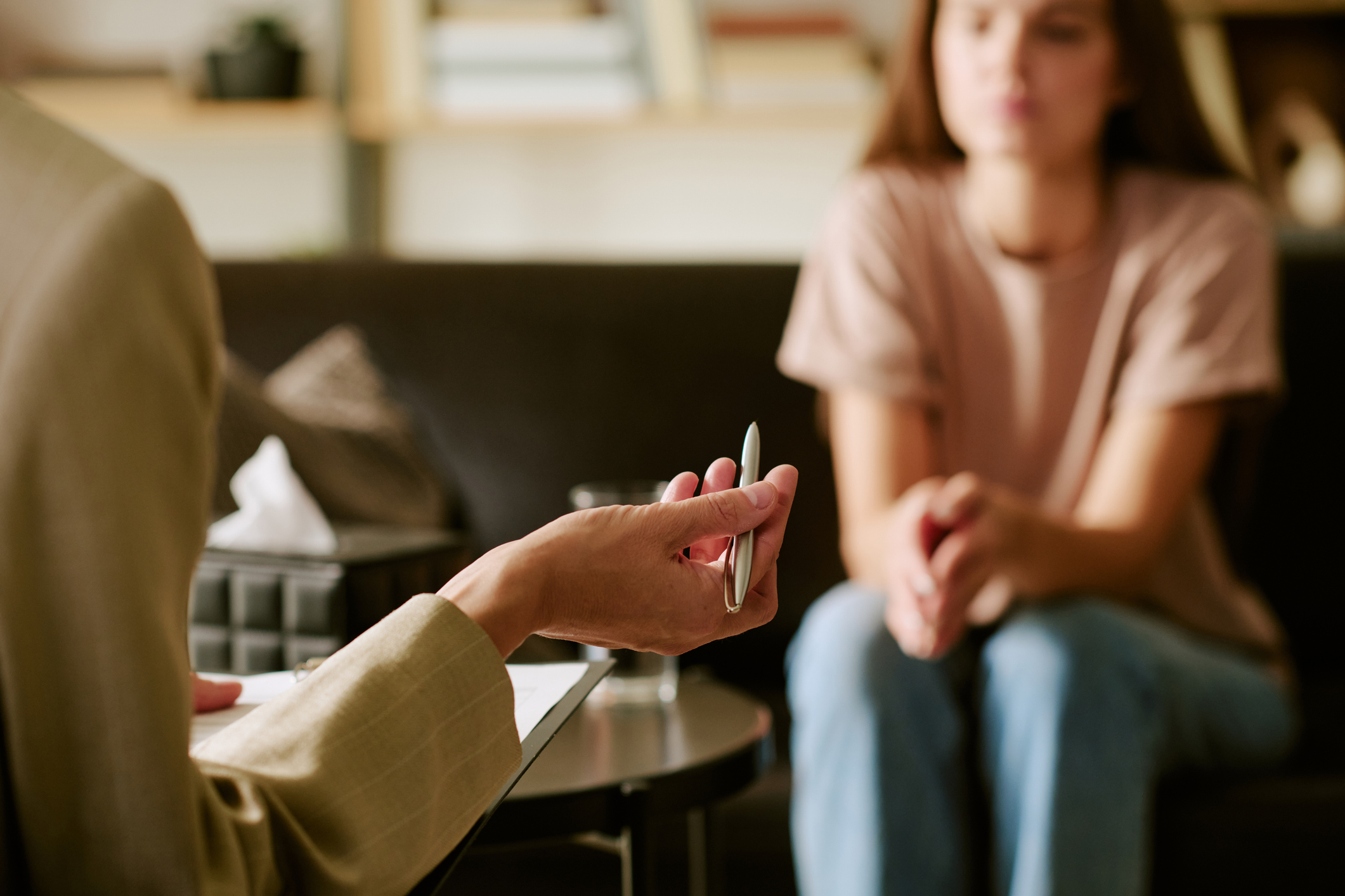 Caucasian Young Woman Attending Psychological Counseling Session Indoors